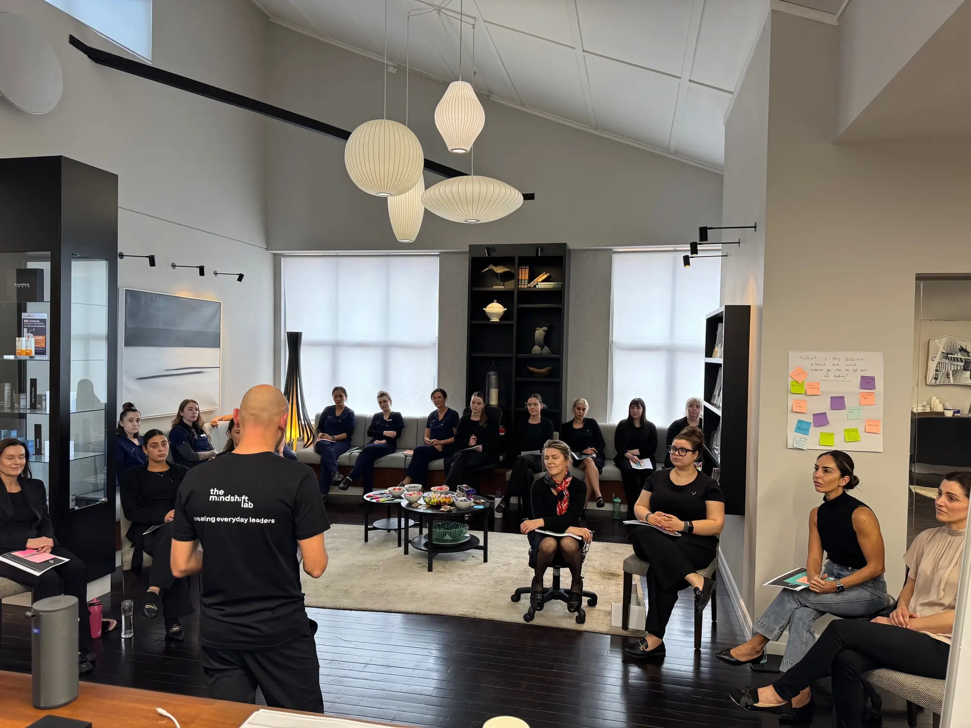 Steve Morris running a team development session for the Valley Plastic Surgery team seated in a circle